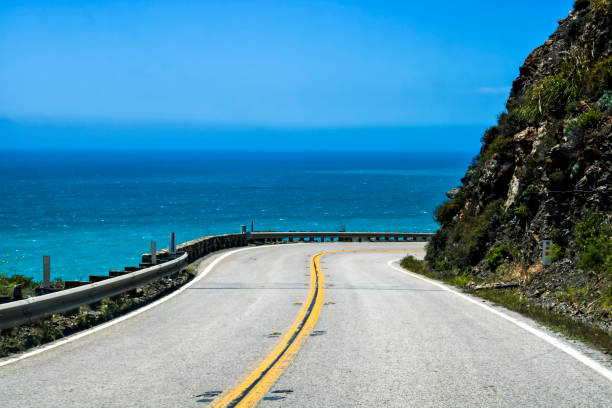 Highway Curves Around with Ocean Background stock photo