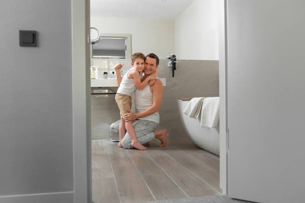 istock Smiling father and son doing morning procedure together 1157450991
