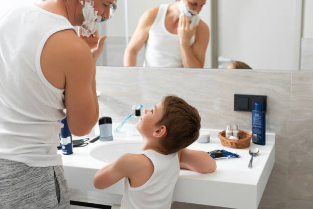istock Father and son are ready for shaving in the bathroom 1157451027