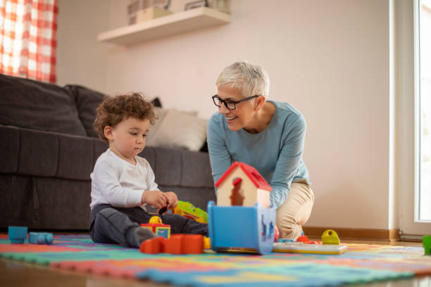 istock Grandmother playing with her grandson 1157451749