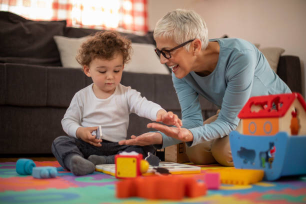 istock Grandmother playing with her grandson 1157451763