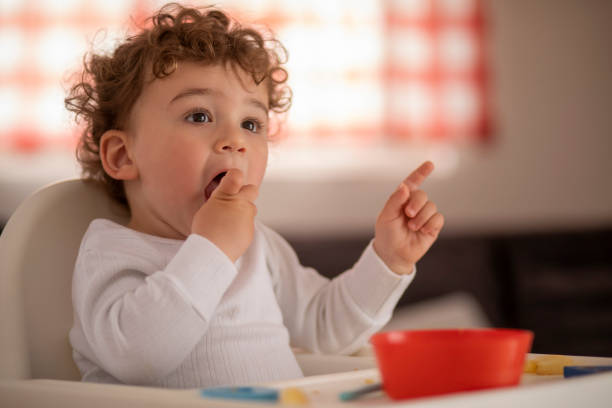 istock Baby boy eating on its own 1157451769