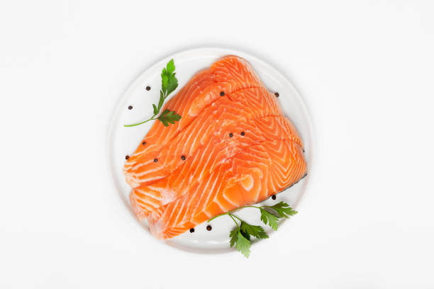 Fresh raw salmon steaks isolated on white background stock photo