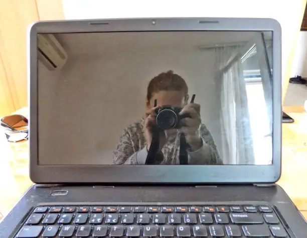 Photo of Self-portrait in the laptop monitor