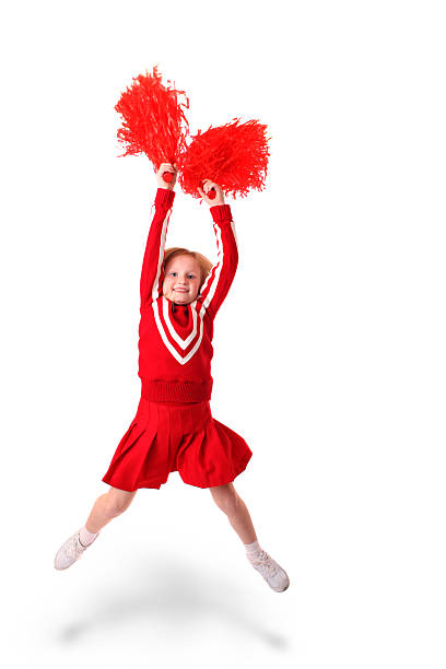 young girl as a cheerleader jumping