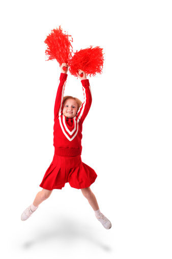young girl as a cheerleader jumping
