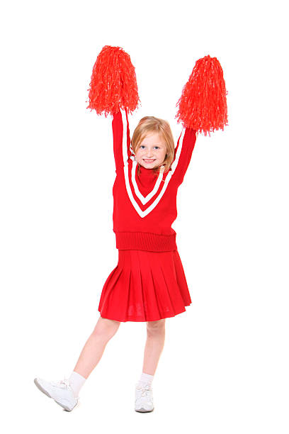 cheerleader with arms raised stock photo