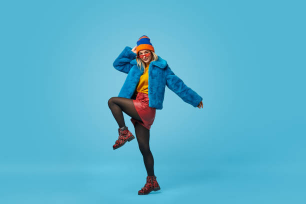 istock Freakish woman dancing and looking at camera 1157459044