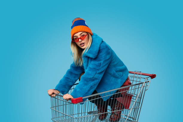 istock Crazy female in shopping cart 1157459059