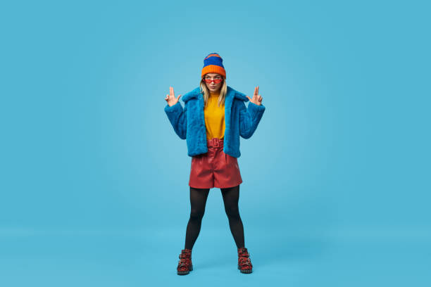 istock Weird female gesturing hand guns and looking away 1157459062