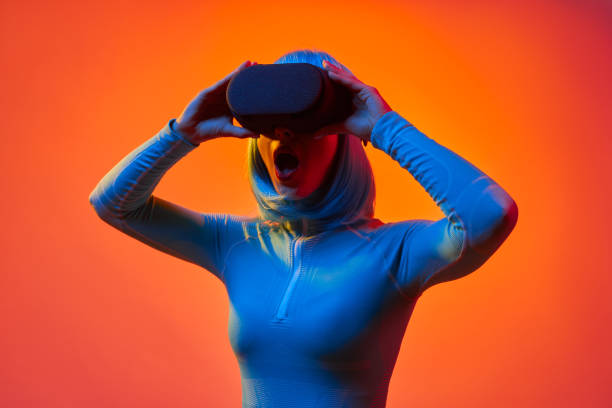istock Futuristic woman in VR glasses screaming 1157459586