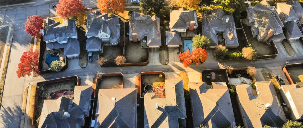 istock Panoramic aerial view typical house with light snow covered roof in cold fall morning 1157459964