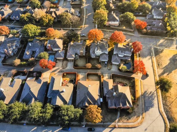 istock Top view typical park side houses with light snow covered roof in cold fall morning 1157459974