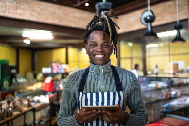 istock Confident business owner standing at restaurant 1157463906