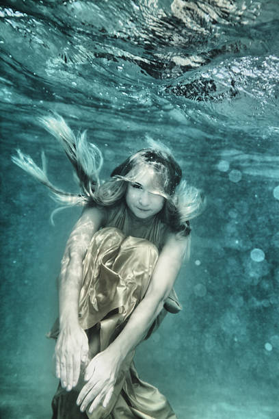 Woman underwater stock photo