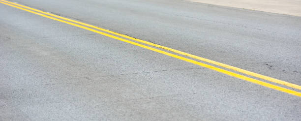 istock Pair of yellow road lines. 1157464069