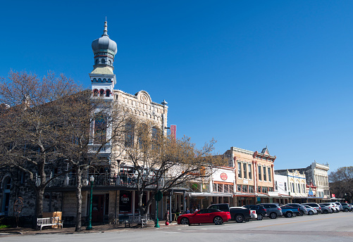 Georgetown, USA - March 13, 2019. Historic buildings in downtown of Georgetown, Texas, with people on sidewalk.