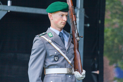 Augustdorf / Germany - June 15, 2019: German soldier from the guard battalion walks on a stage at Day of the Bundeswehr 2019.