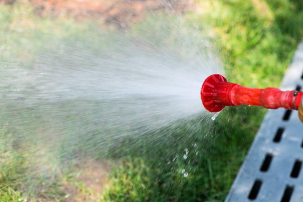 istock Water gushing from a red high-pressure faucet 1157474563