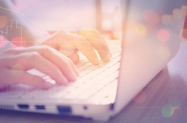 istock Business economic and technology working concept. Woman hand using notebook double exposure with graph money stock trading and blur bokeh light background. Vintage tone filter effect color style. 1157478154