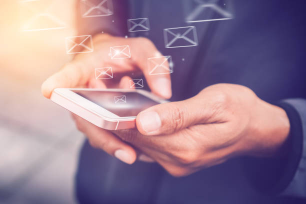 istock Copy space hand using smart phone and bokeh sun light on street double exposure email draw graphic background. Travel adventure lifestyle and business economic concept. Vintage tone effect color style 1157480177