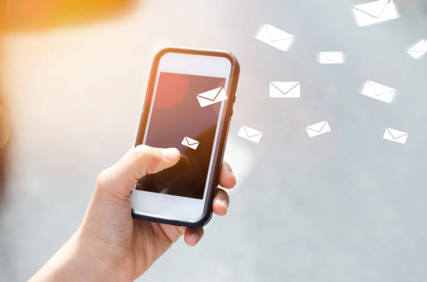 istock Copy space hand using smart phone and bokeh sun light on street double exposure email draw graphic background. Travel adventure lifestyle and business economic concept. Vintage tone effect color style 1157480182