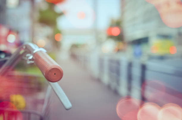 Copy space of blur bicycle parking with colorful bokeh light abstract background. Transportation ecology and health care concept. Vintage tone filter effect color style.