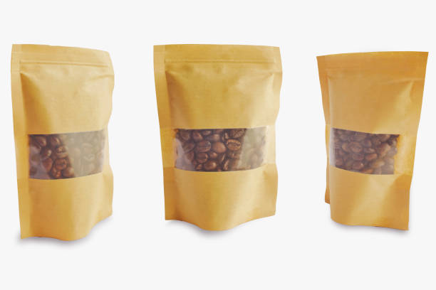 istock Coffee beans are packed in paper bags on white background. 1157481200