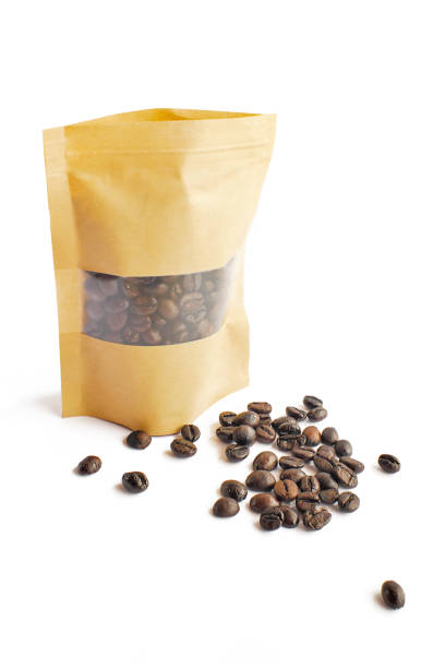 istock Coffee beans are packed in paper bags on white background. 1157481290