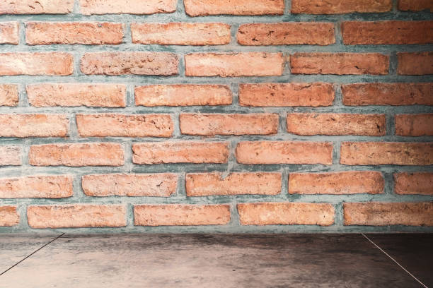 istock Dark room stone brick wall texture background. Copy space for product presentation and graphic design. 1157485476