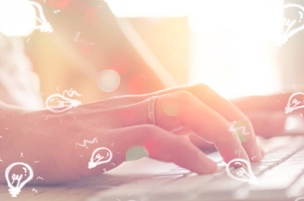 istock Idea creative and technology business economic concept. Close up woman hand using keyboard and personal computer double exposure light bulb abstract background. Vintage tone filter effect color style. 1157488115
