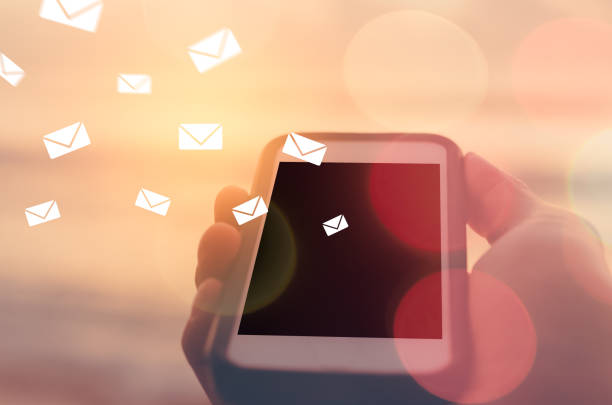 istock Man hand using smart phone double exposure email fly draw bokeh at beach .Business economic technology working connect and travel adventure summer holiday concept. Vintage tone filter color style. 1157488149