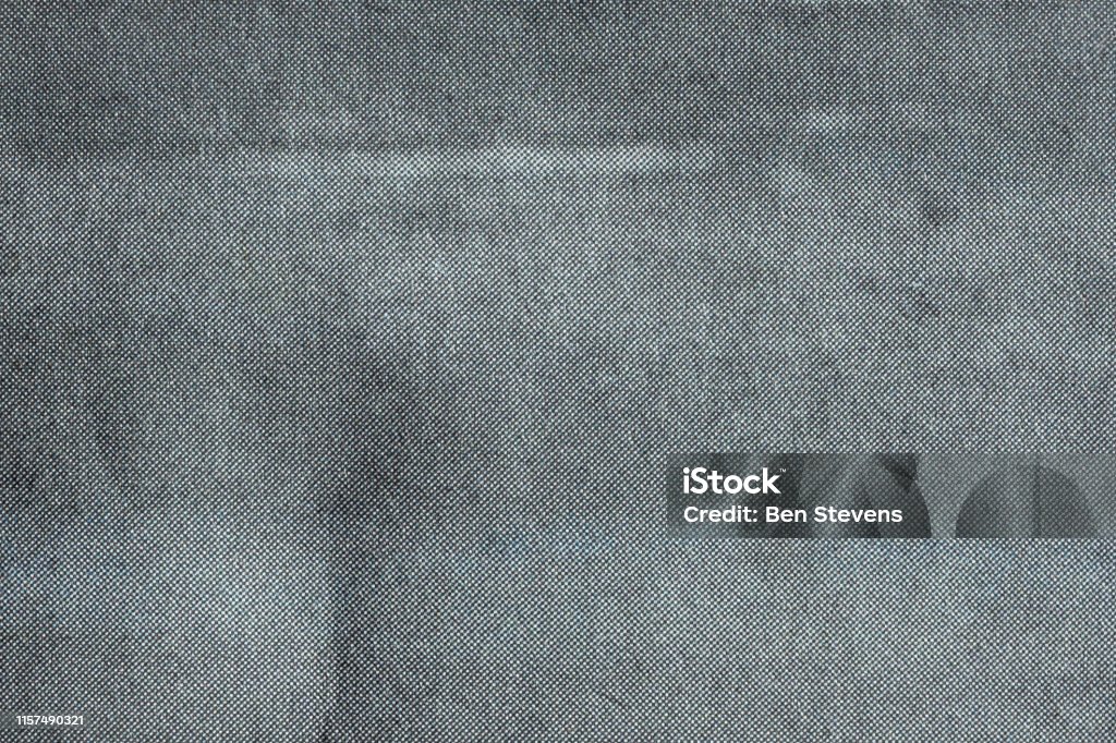 Macro of grey halftone dots on newsprint Close up image of grey CMYK dots on newsprint Textured Stock Photo