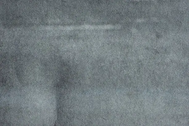 Close up image of grey CMYK dots on newsprint