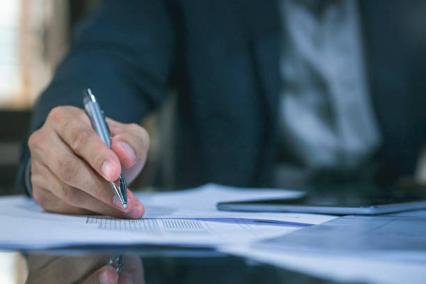 istock Close up of business man working at office. 1157493108