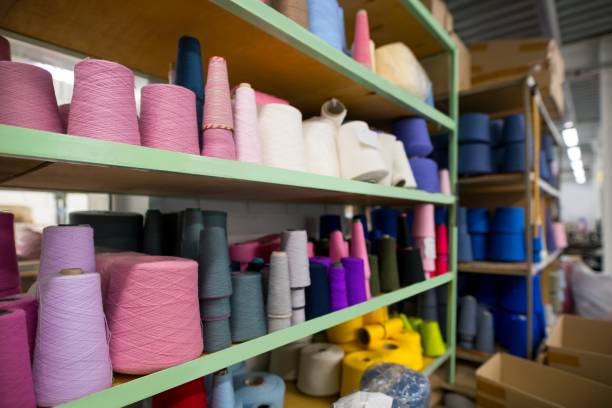 istock Sewing thread bobbins in manufactoring plant 1157493351