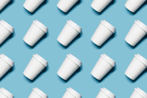 istock Lot of paper cups on blue background 1157497202