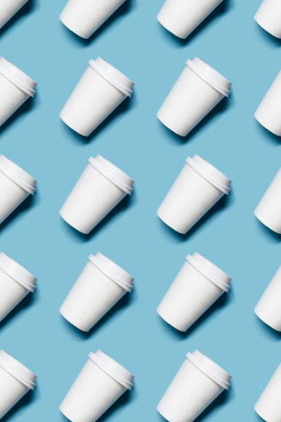 istock Lot of paper cups on blue background 1157497203