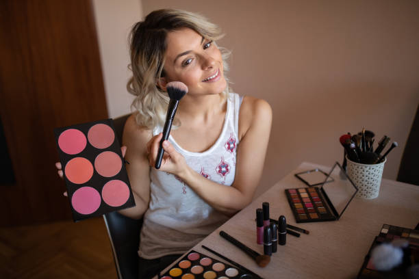 istock Beautiful young woman vlogging about cosmetics 1157498025