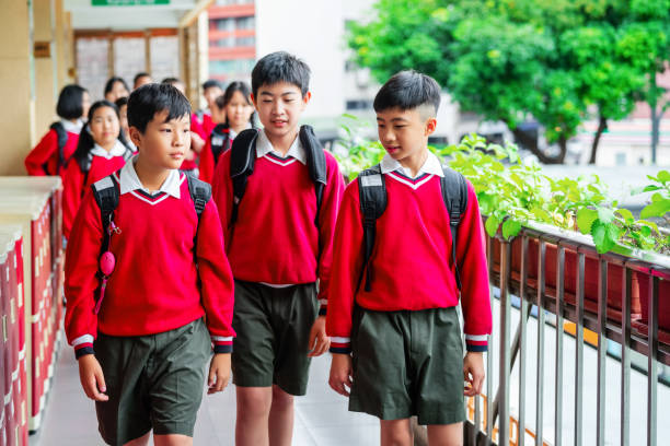 istock Male students walking in school campus 1157498171