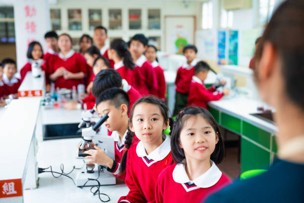 istock Students with teacher in chemistry class 1157499950