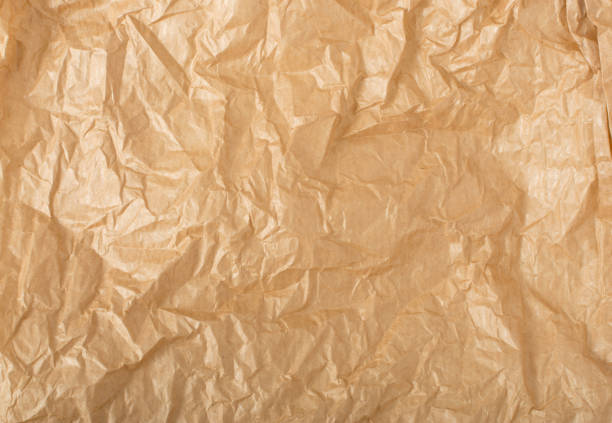 istock Crumpled Craft Paper Top View with Copy Space for Collages 1157502042