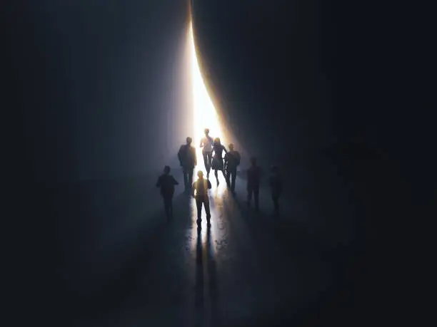 group of people at the door leading to the light