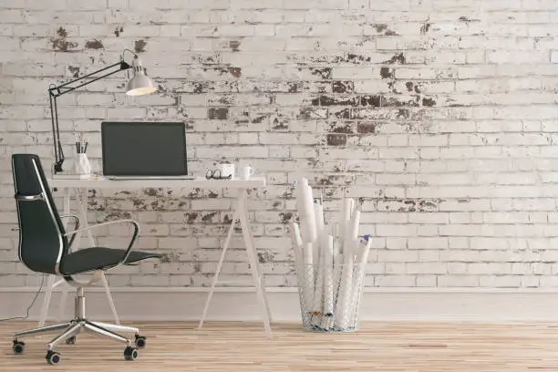 Workdesk with decoration on hardwood floor in front of empty white brick ruined wall with copy space. 3D rendered image.