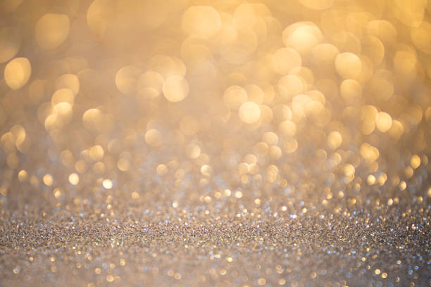 istock Silver glitter christmas abstract background in golden light 1157511785