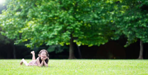 istock Girl relaxing on the grass 1157512575