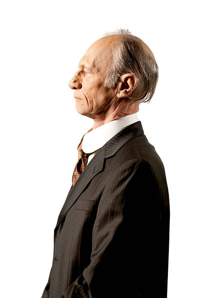 istock Profile of an old man wearing a suit on white. 115751342