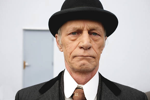 istock Old man wearing a hat outdoors . 115751345