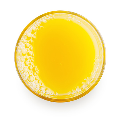 top view of glass of orange juice isolated on white background