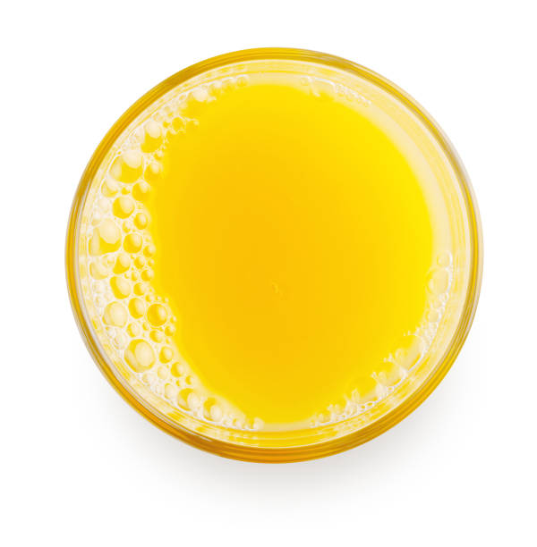 top view of orange juice top view of glass of orange juice isolated on white background orange juice stock pictures, royalty-free photos & images